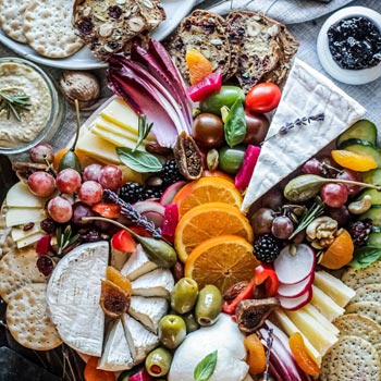 Tasting plate of food including processed and fresh items